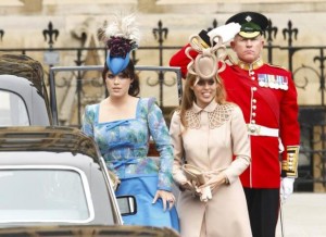Britain's Princess Eugenie and Princess Beatrice arrive at Westminster Abbey before the wedding of Britain's Prince William and Kate Middleton, in central London